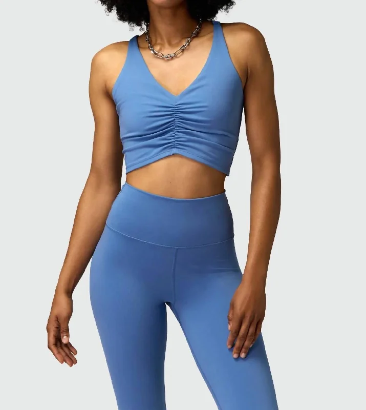 Everly Twist Back Sports Bra In Pacific Blue